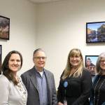 Snoqualmie Elementary staff and parents thanked photographer Don Detrick for his scenic photos, contributed to brighten the school office. Pictured from left are SES Registrar and school secretary Michelle Pearlstein, artist Don Detrick, secretary Shannon Smith and SES PTSA President Kim Jones. (Photo courtesy of Abbey Cantrell)