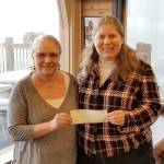 Kiwanis President Marie Jackson presented Mt. Si Senior Center Executive Director Susan Kingsbury-Comeau with a $500 check, the first award in the Kiwanis new community service grant program, Thursday, Feb. 15. (Courtesy Photo)