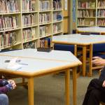Jay Dilger answers questions about her book from teacher Marianne Bradburn, left, and librarian Nancy Huestis in the Opstad Elementary School library. (Carol Ladwig/Staff Photo)
