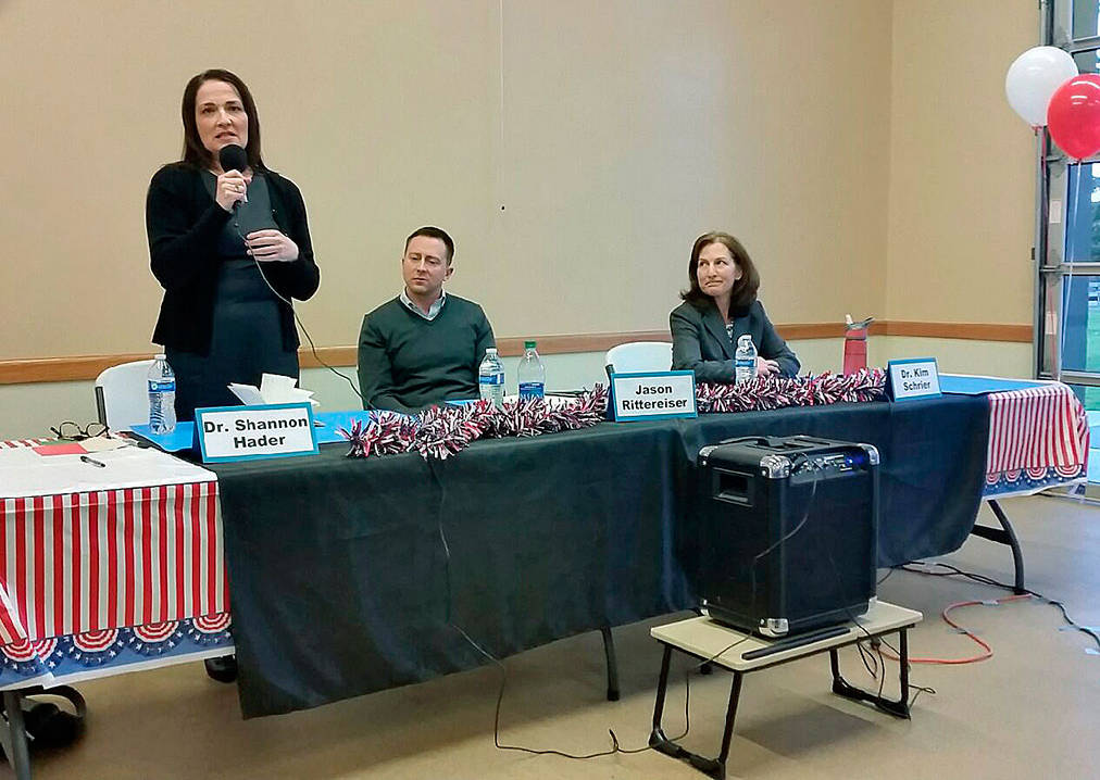 Dr. Shannon Hader, a candidate for the 8th Congressional District seat, fields a questions as her opponents, Jason Rittenreiser and Kim Schrier, look on during their debate in Auburn on March 16. Robert Whale/staff photo