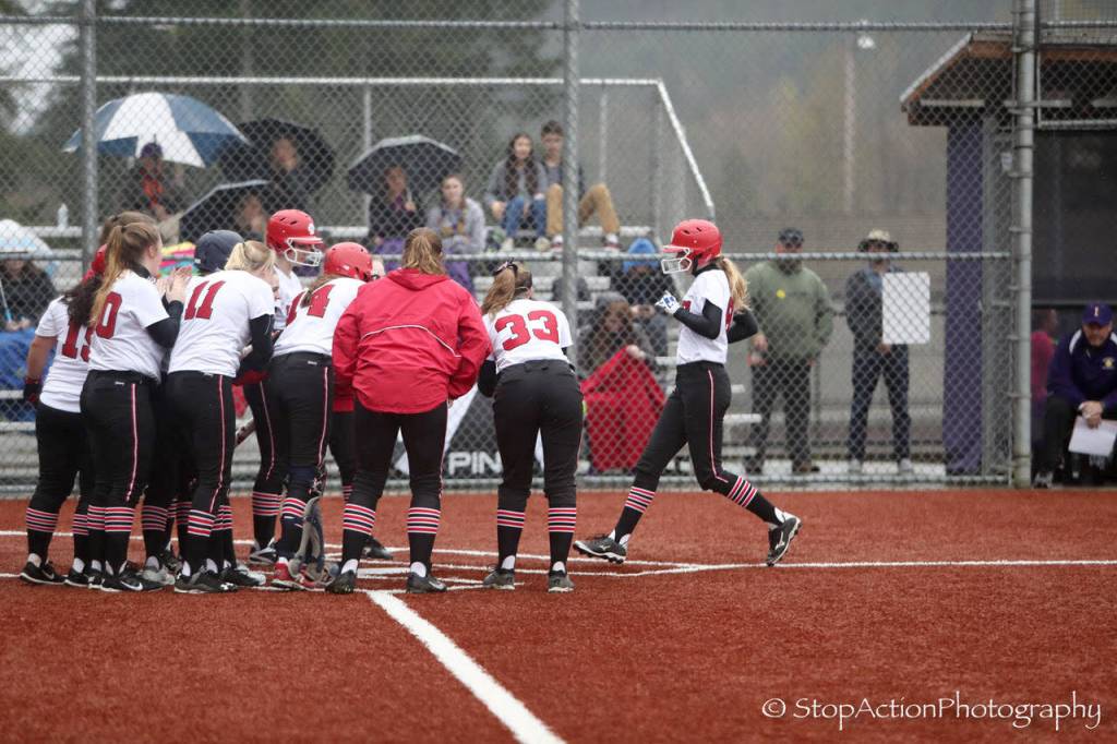 Photo courtesy of Don Borin/Stop Action Photography                                Mount Si Wildcats players surround Sam Simmons after she connected on a home run to left field in the top of the fifth inning. Mount Si defeated Issaquah, 6-4, on April 5.