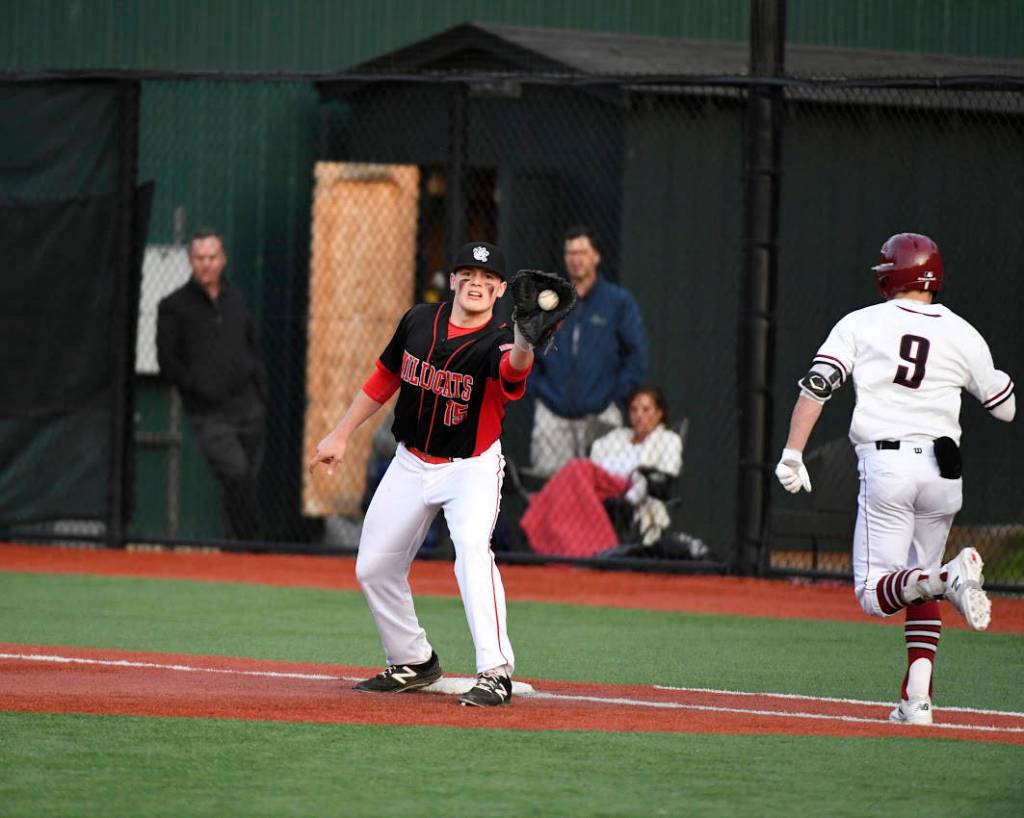 Photo courtesy of Calder Productions                                The Mount Si Wildcats defeated the Eastlake Wolves 9-5 in a battle between KingCo 4A teams on April 9. Mount Si improved its overall record to 7-5 with the win. Mount Si first infielder Michael Collins hauls in a toss from the infield, getting Eastlake runner Dalton Chandler out at first base.
