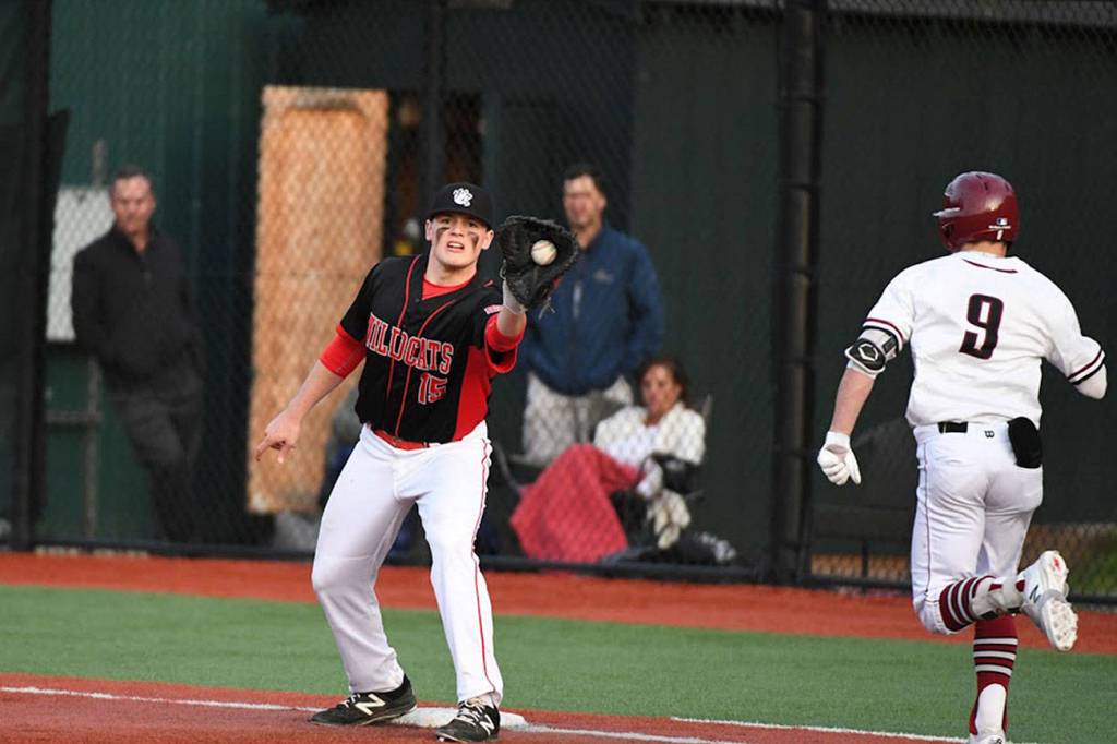 Photo courtesy of Calder Productions                                The Mount Si Wildcats defeated the Eastlake Wolves 9-5 in a battle between KingCo 4A teams on April 9. Mount Si improved its overall record to 7-5 with the win. Mount Si first infielder Michael Collins hauls in a toss from the infield, getting Eastlake runner Dalton Chandler out at first base.