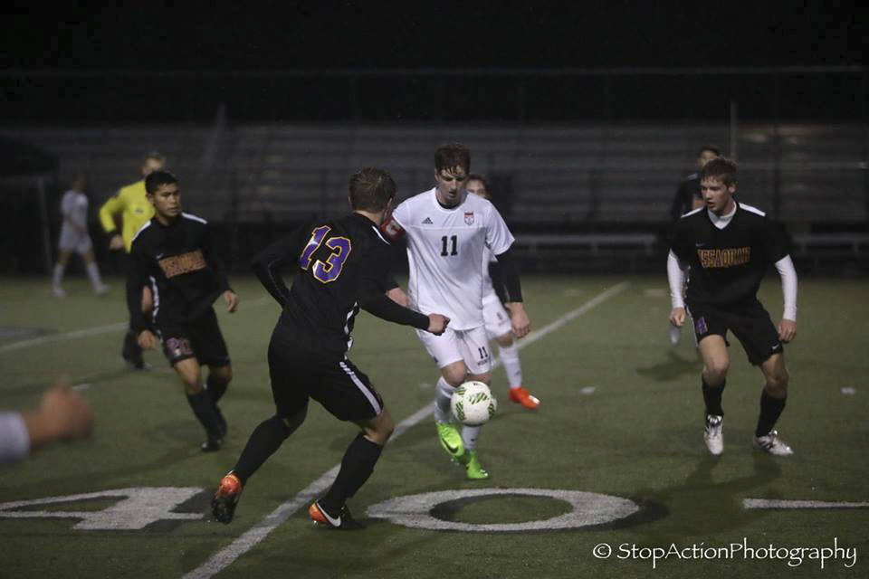 Photo courtesy of Don Borin/Stop Action Photography                                Mount Si Wildcats senior midfielder Kyle Hunter, center, is surrounded by Issaquah Eagles players in a matchup between KingCo 4A rivals on April 13 at Mount Si High School. Issaquah defeated Mount Si 2-0.