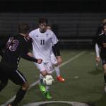 Photo courtesy of Don Borin/Stop Action Photography                                Mount Si Wildcats senior midfielder Kyle Hunter, center, is surrounded by Issaquah Eagles players in a matchup between KingCo 4A rivals on April 13 at Mount Si High School. Issaquah defeated Mount Si 2-0.