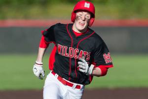 Photo courtesy of Patrick Krohn/Patrick Krohn Photography                                Mount Si Wildcats senior Logan Van Campen hustles to home-plate, scoring a run for his team in the top of the seventh inning. The Issaquah Eagles defeated the Mount Si Wildcats 8-4 in a loser-out, KingCo 4A playoff game on May 4 at Bannerwood Park in Bellevue.