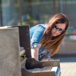 Piano artist Natalie Martin of Sequim sands down the piano that filled the Port Angeles downtown streets with music last year during a work party Saturday. (Jesse Major/Peninsula Daily News)