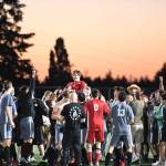 The adoring crowd gives Colby Ramsey a lift after he converted the game-winning penalty kick against Issaquah. Photo courtesy of Calder Productions