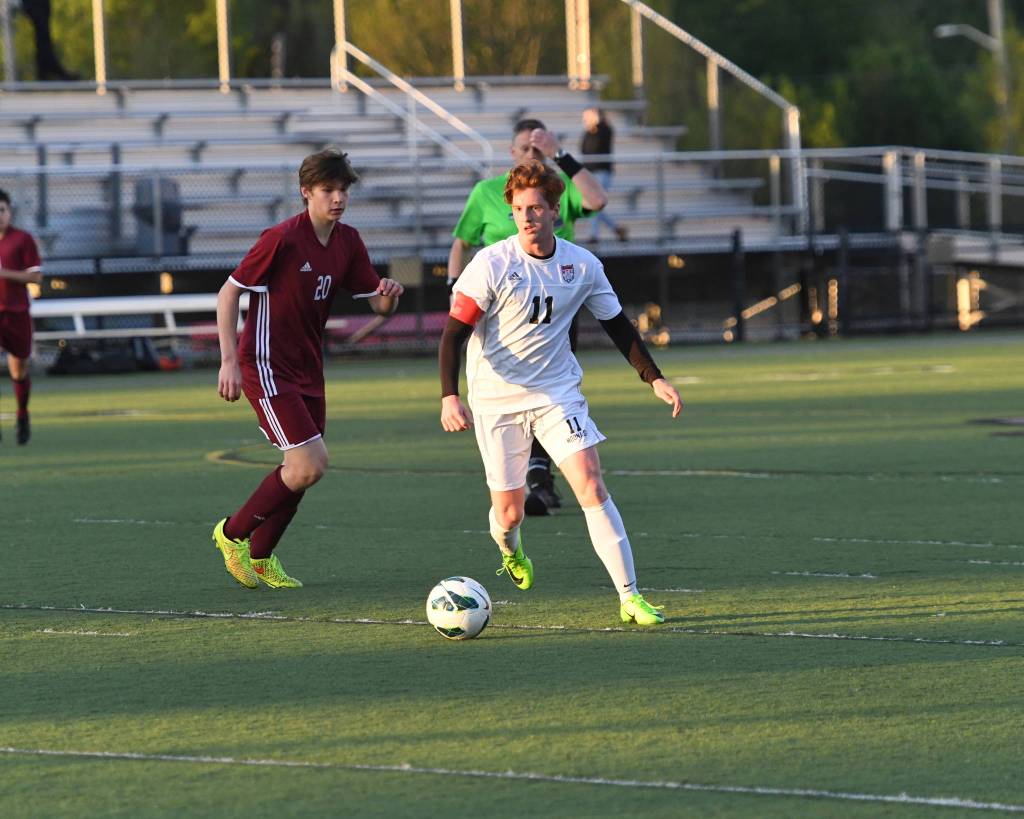 Mount Sis Kyle Hunter, right, controls the ball against Eastlake. Photo courtesy of Calder Productions