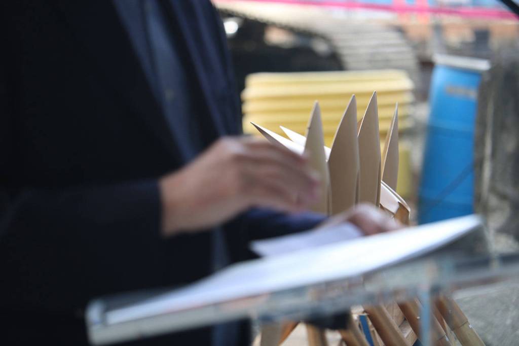 A row of stacked shovels sits behind Bellevue mayor John Chelminiak as he gave a speech at a May 9 groundbreaking ceremony at Overlake Medical Center. The expansion will be the largest in the hospitals 58-year history. Aaron Kunkler/Staff photo