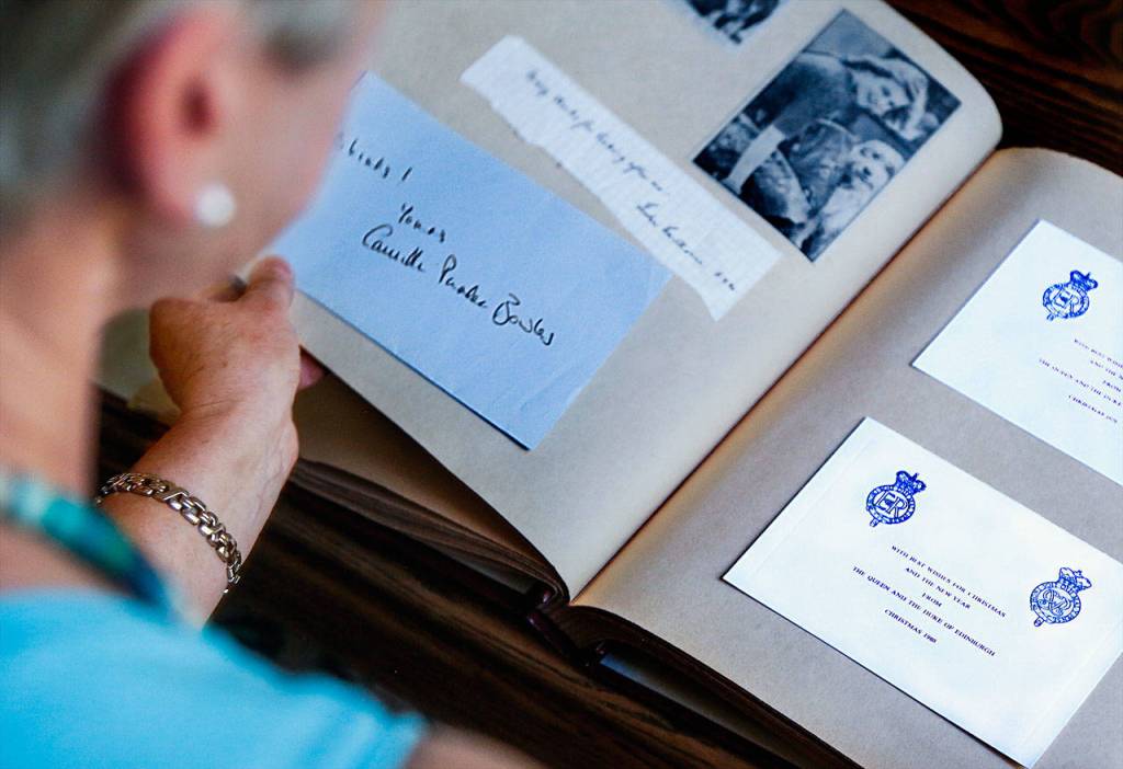 Among Janette Huskies scrapbook items is a handwritten note to her from Camilla Parker Bowles, now the wife of Prince Charles, as well as Christmas cards from Queen Elizabeth. (Dan Bates / The Herald)