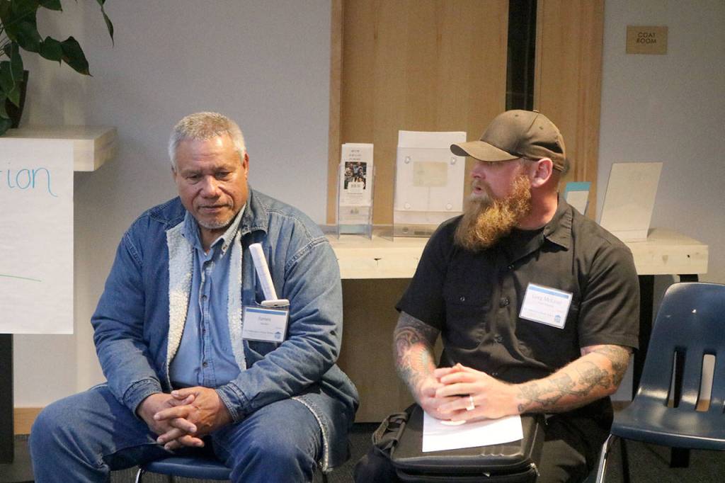 James, left, speaks about his time living in homelessness with his case manager Greg McLeod from Attain Housing. Evan Pappas/Staff Photo