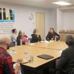 A small group discusses how domestic violence can lead women to homelessness. Evan Pappas/Staff Photo