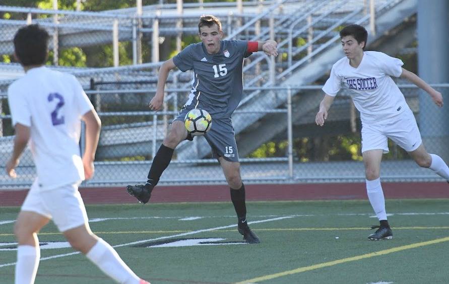 Alec Bothwell, center, controls the ball during a league match. Photo courtesy of Calder Productions