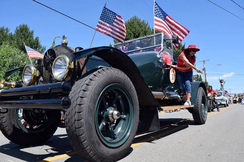 Antique fire trucks are just part of the old-fashioned charm of the Maxwelton Fourth of July Parade. Its seeking donations to stay afloat. File photo