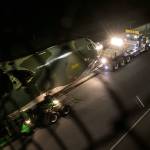 The B-52 Midnight Express is towed along Highway 525 from Paine Field en route to Boeing Field in Seattle early Sunday morning. (Kevin Clark / The Herald)