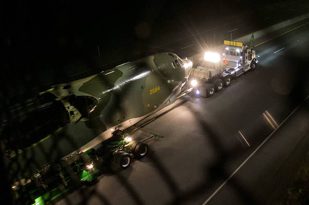 The B-52 Midnight Express is towed along Highway 525 from Paine Field en route to Boeing Field in Seattle early Sunday morning. (Kevin Clark / The Herald)