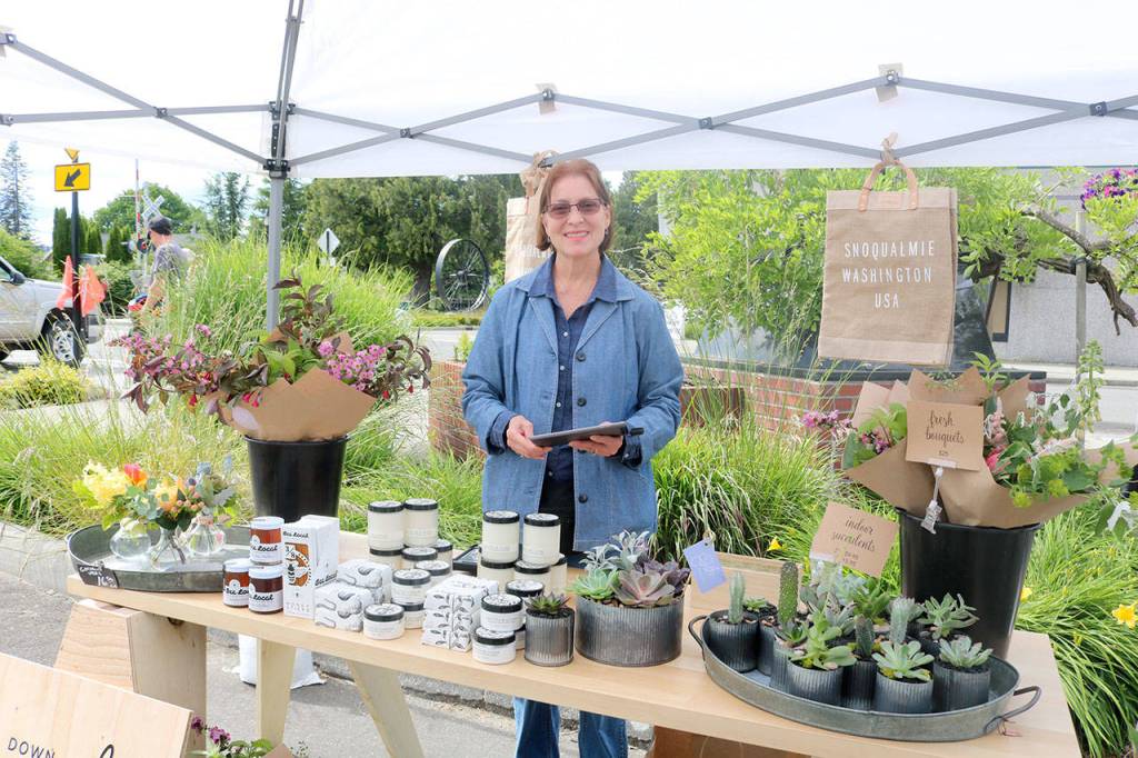 Down to Earth Flowers and Gifts had their own booth at the market on Friday. Evan Pappas/Staff Photo