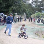 A father chases after his son on the beginners track. Evan Pappas/Staff Photo