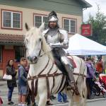 A knight, part of the Society for Creative Anachronism, rides by in the Fall City Day Parade. Evan Pappas/Staff Photo