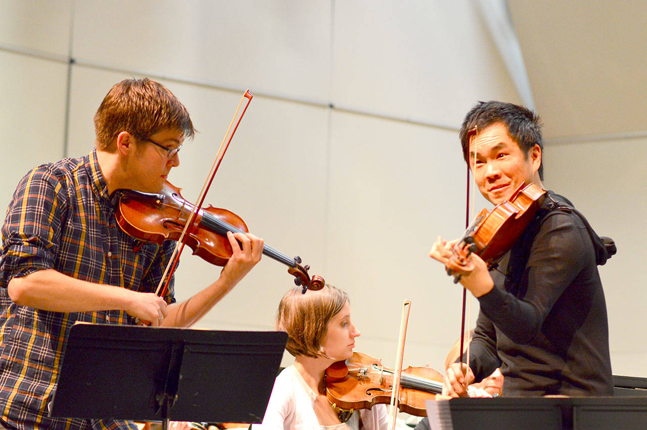James Garlick, left, and Richard ONeill, here rehearsing for a 2017 Port Angeles Symphony concert, are artistic directors of the new Music on the Strait festival. (Diane Urbani de la Paz/for Peninsula Daily News)