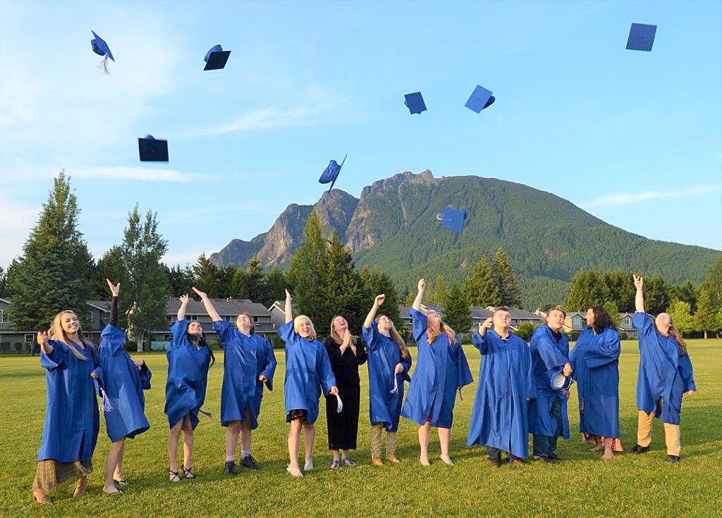 Seniors from Two Rivers School throw their caps after graduating on June 6. Photo courtesy of Mary Miller