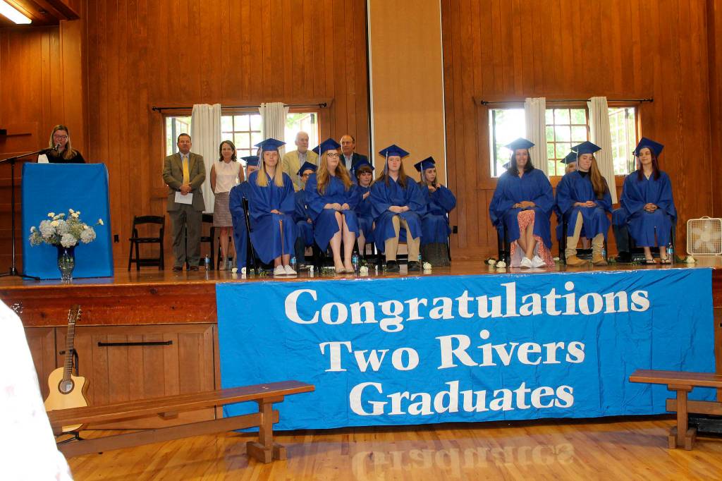 Two Rivers School seniors sit on stage during the graduation ceremony. Photo courtesy of Two Rivers School
