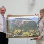 North Bend Mayor Ken Hearing presents gave outgoing council member Jeanne Petterson a large photo of Mount Si as a going away present on behalf of the city. Evan Pappas/Staff Photo