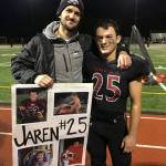 Jake Leland supports Jaren Stevenson at Jarens football senior night. Photo courtesy of Jake and Madison Leland