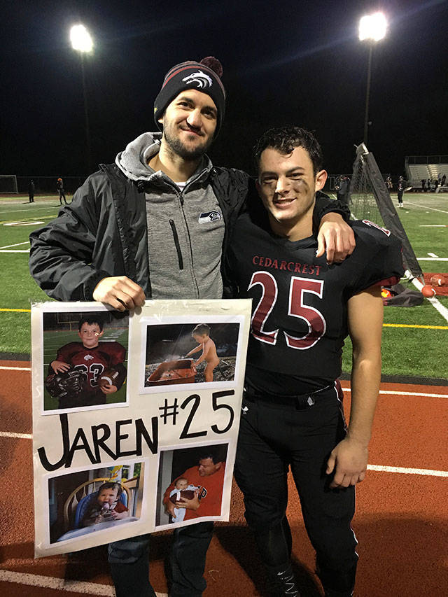 Jake Leland supports Jaren Stevenson at Jarens football senior night. Photo courtesy of Jake and Madison Leland
