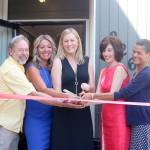 Representatives from North Bend and King County help The Trail Youth cut the ribbon on the official grand opening of the coffee house. From left: North Bend Mayor Ken Hearing, Tonya Guinn, Wendy Laxton, Kristin Zuray, and King County Best Starts for Kids Strategic Advisor Sheila Capestany. Evan Pappas/Staff Photo
