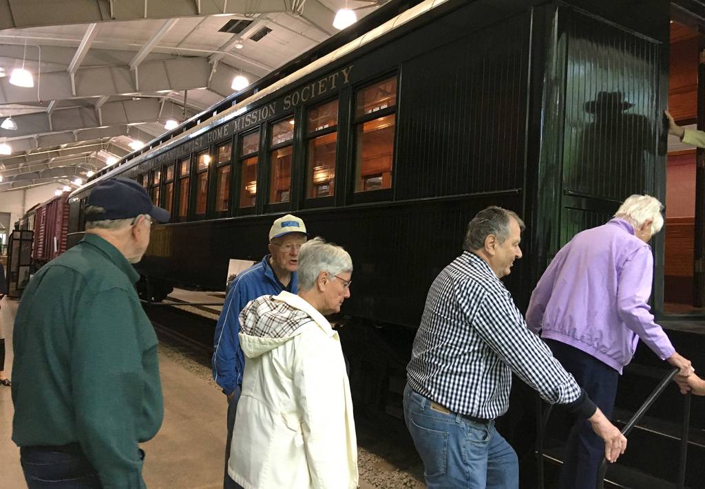 Mercer Island retirees board a 19th century railroad car at the Northwest Railway History Center. Photo courtesy of Greg Asimakoupoulos