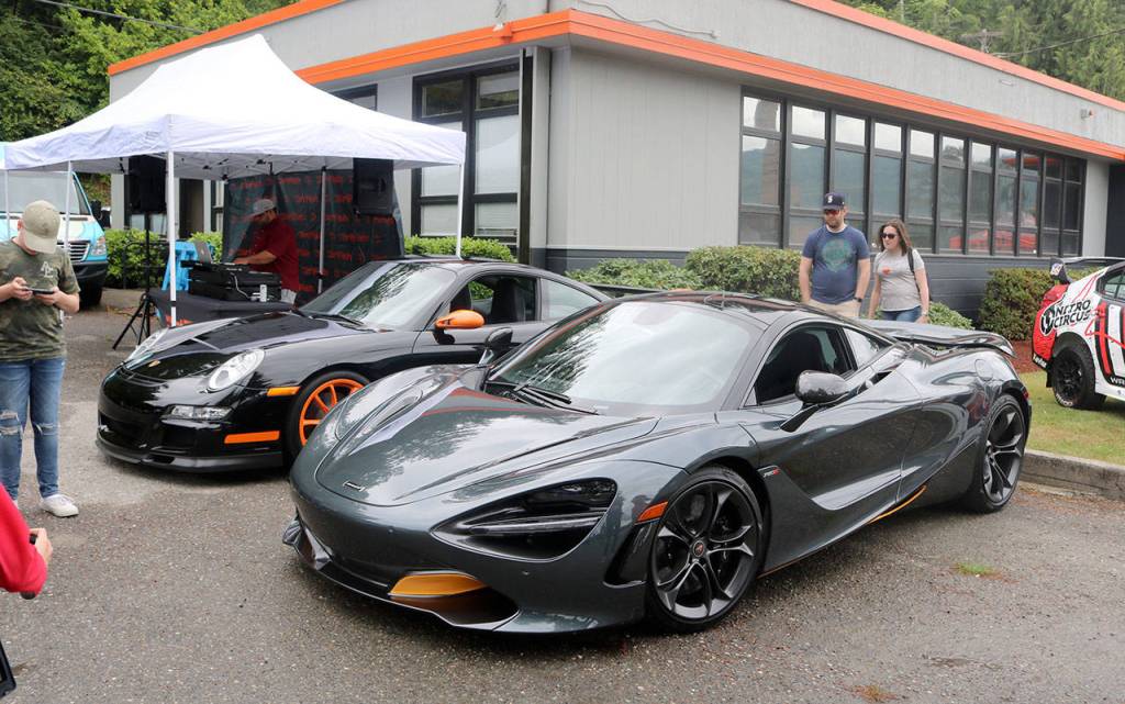 A McLaren 720S and Porsche GT3RS were on display as people entered the festival. Evan Pappas/Staff Photo