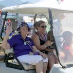 Bev Jorgensen makes the lap around Tollgate Farm Park, cheered on by friends and supporters. Evan Pappas/Staff Photo