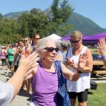 Beth Stewart, a 23-year cancer survivor, makes here way through the crowd getting high-fives from everyone in line. Evan Pappas/Staff Photo