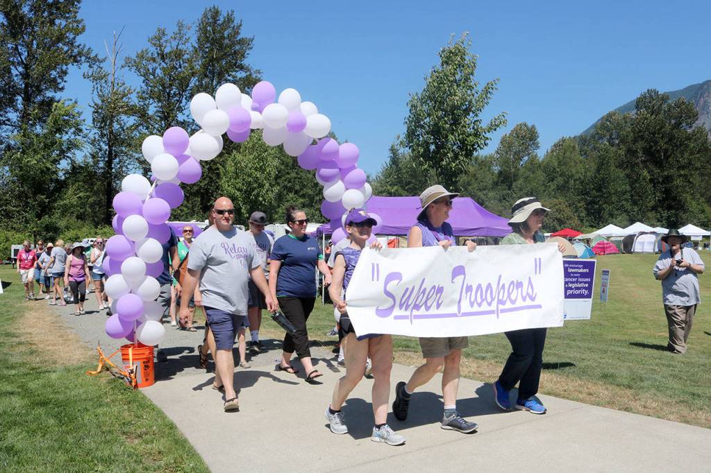 The Super Troopers fundraising group begins their first lap on Saturday afternoon. Evan Pappas/Staff Photo