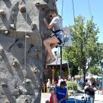 The rock-climbing wall at the Block Party drew a steady stream of adventurers Saturday. Carol Ladwig/Staff Photo