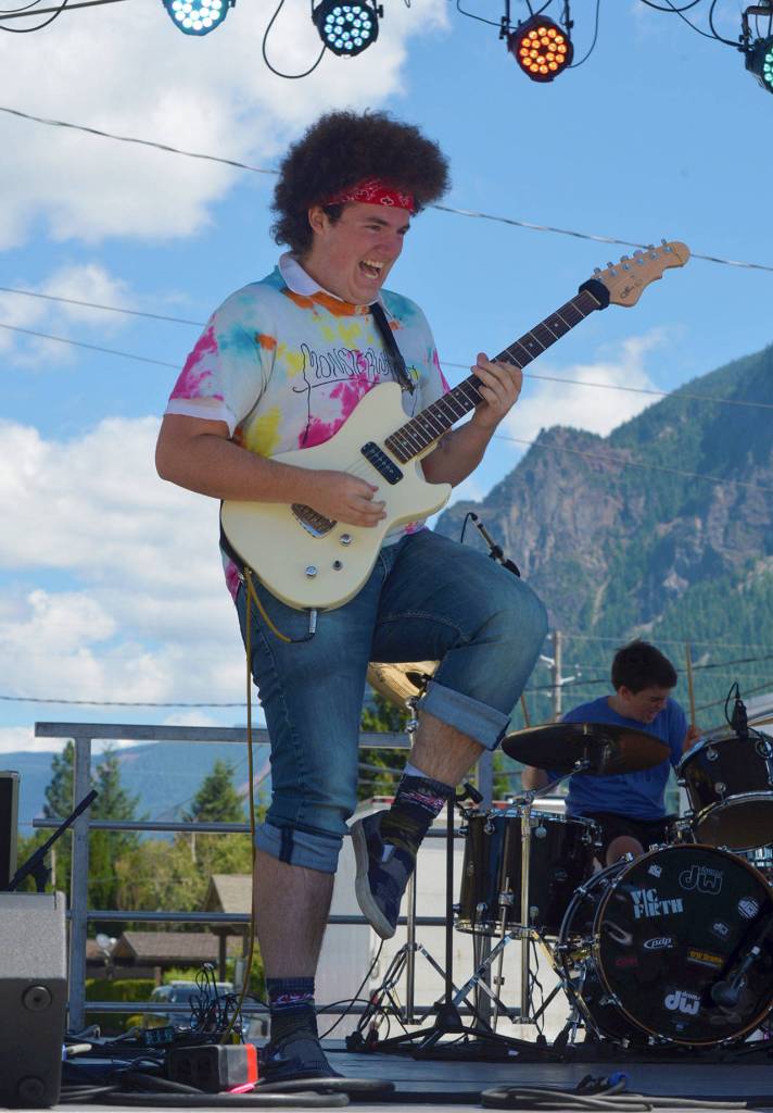 Ryan, guitar, and Ethan Horn, drums, of LocoMotive perform on the main stage. Photo courtesy of Mary Miller.