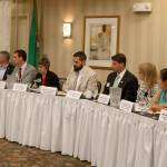 The legislative candidates sat at the table to the right of the moderator at the forum. From left: Bill Ramos, Chad Magendanz, Paul Graves, Lisa Cullen, Nathaniel Deily, Tim Cruickshank, Wendy Weiker, My-Linh Thai, and Michael Appleby. Evan Pappas/Staff Photo
