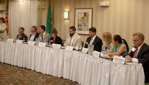 The legislative candidates sat at the table to the right of the moderator at the forum. From left: Bill Ramos, Chad Magendanz, Paul Graves, Lisa Cullen, Nathaniel Deily, Tim Cruickshank, Wendy Weiker, My-Linh Thai, and Michael Appleby. Evan Pappas/Staff Photo
