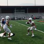 Mount Si running back Paine Smith, right, hauls in a swing pass from Cale Millen before preparing to make a move past a defender at an afternoon practice session on Aug. 15 in Snoqualmie. Shaun Scott/staff photo