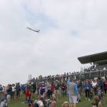 The crowd looks around to spot the Boeing plane flying above them. Evan Pappas/Staff Photo