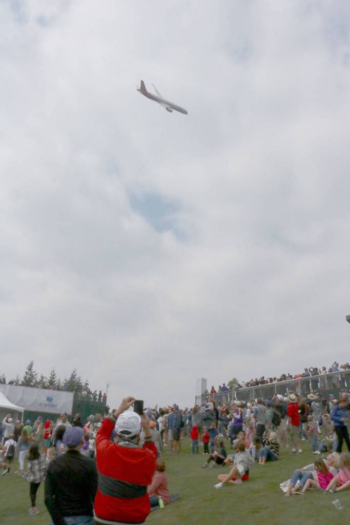 Everyone grabs their phones to get a picture of the low-flying plane. Evan Pappas/Staff Photo