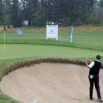 Players warm up on the practice green before the tournament begins. Evan Pappas/Staff Photo