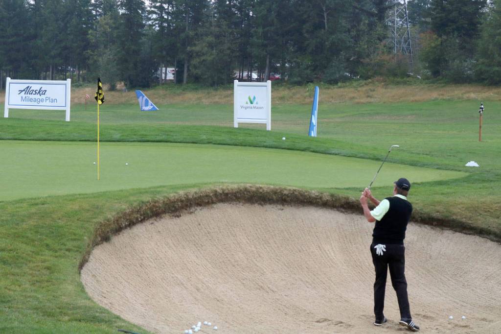Players warm up on the practice green before the tournament begins. Evan Pappas/Staff Photo
