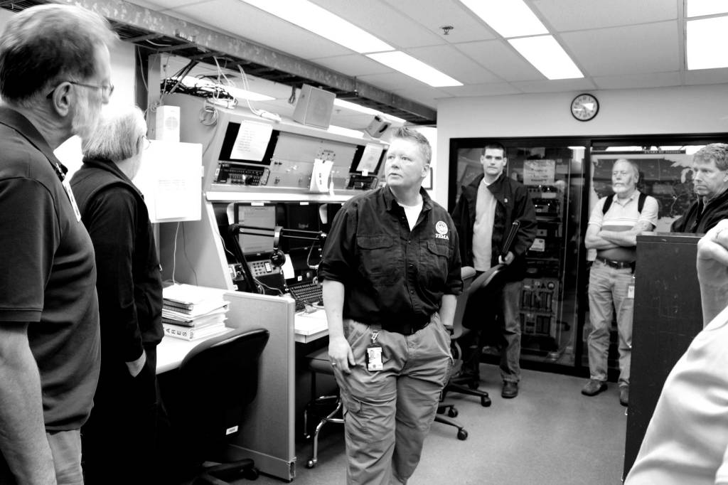 Laura Goudreau of FEMAs Disaster Emergency Communications shows the Cascadia Rising 2016 exercise Communications Sub-Workgroup the Regional Communications Center in Bothell. This room maintains emergency channels during disasters, which can be a critical component of life and property saving missions. Photo courtesy of Savannah Brehmer, FEMA