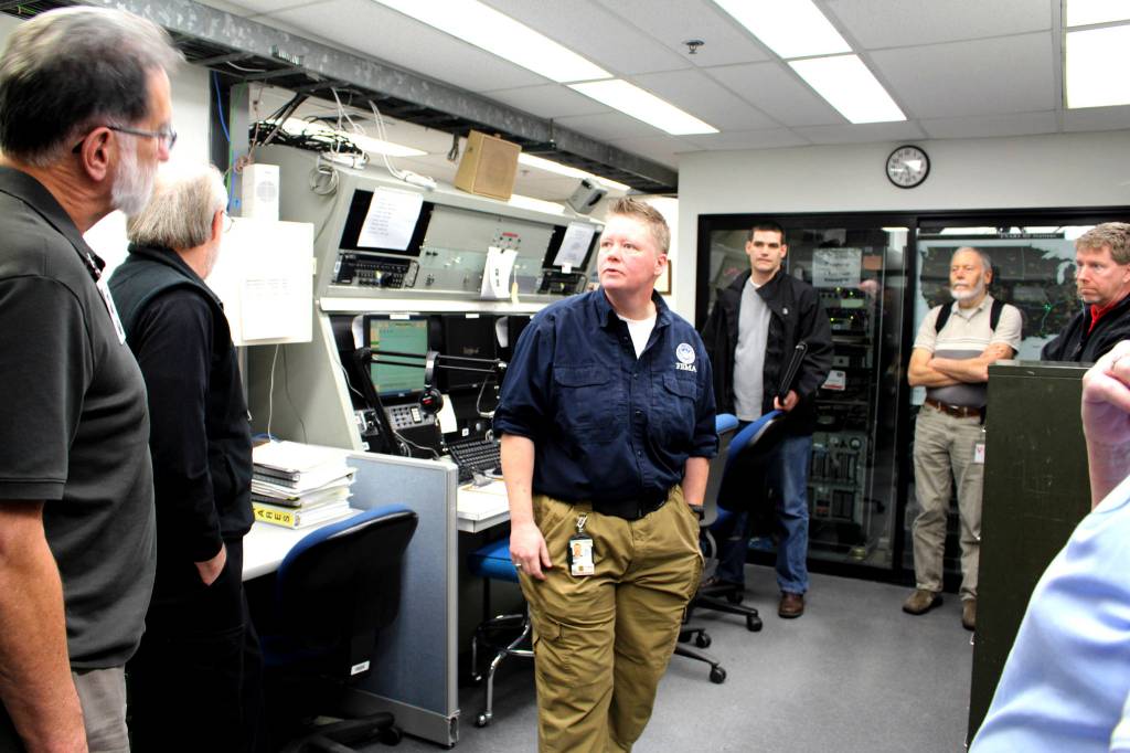 Laura Goudreau of FEMAs Disaster Emergency Communications shows the Cascadia Rising 2016 exercise Communications Sub-Workgroup the Regional Communications Center in Bothell. This room maintains emergency channels during disasters, which can be a critical component of life and property saving missions. Photo courtesy of Savannah Brehmer, FEMA