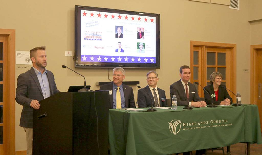 Mediator Nate Perea leads the four candidates through several questions regarding important issues for the fifth legislative district. Evan Pappas/Staff Photo