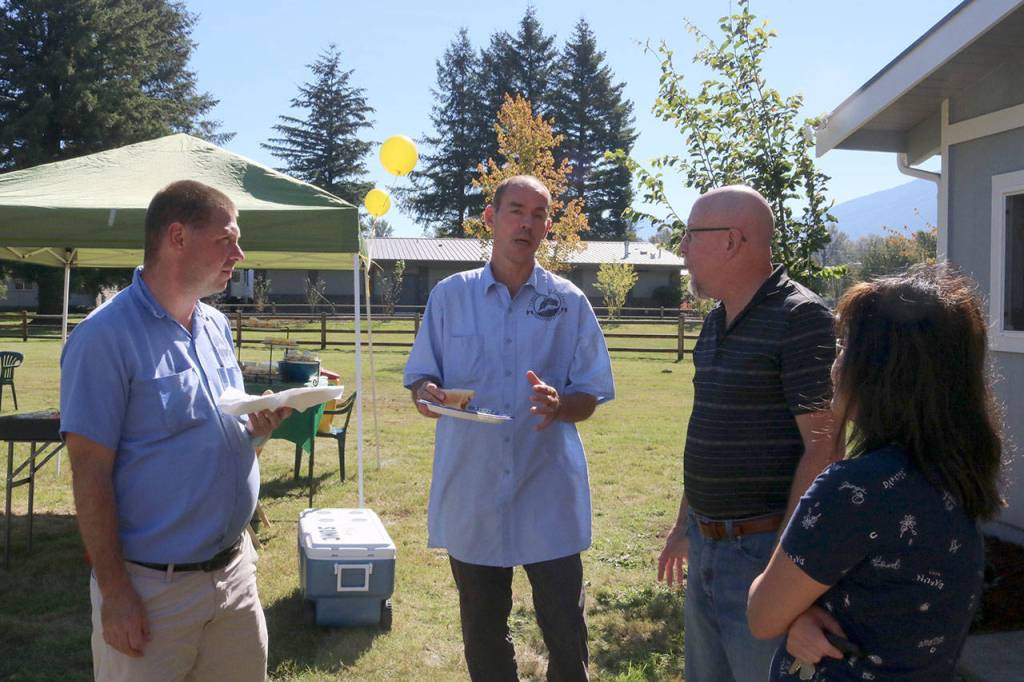 Driver Sean Hickey talks about his role as a driver with others at the 15th anniversary celebration. Evan Pappas/Staff Photo