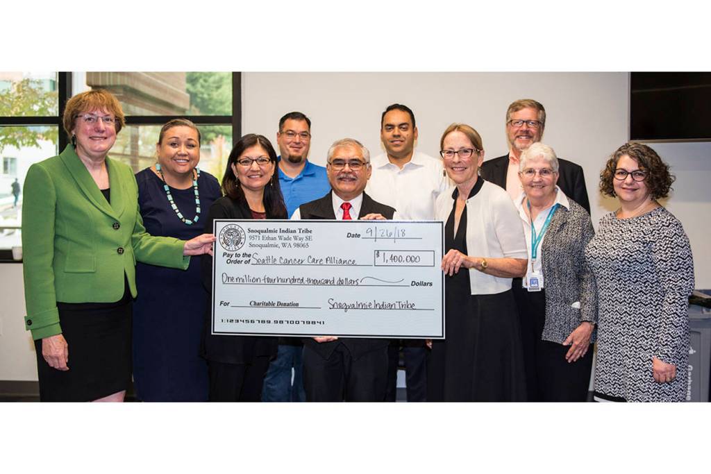 Elected members of the Snoqualmie Tribal Council meet with leaders from the Seattle Cancer Care Alliance to present a check for $1.4 million. From left Dr. Nancy Davidson, executive director and president SCCA, Suzanne Sailto, Snoqualmie Tribal Council, Jolene Williams, Snoqualmie Tribal secretary, Steve de los Angeles, Snoqualmie Tribal deputy secretary, Bob de los Angeles, Snoqualmie Tribal chairman, Michael Ross, Snoqualmie Tribal vice chair, Kari Glover, chair SCCA Board of Directors, Norm Hubbard, executive vice president SCCA, Linda Mattox, chair SCCA Board of Directors Development Committee, Dr. Terry McDonnell, vice president of clinical operations and chief nurse executive SCCA. Photo courtesy of the Snoqualmie Tribe.